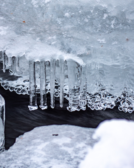 Icicles forming over water
