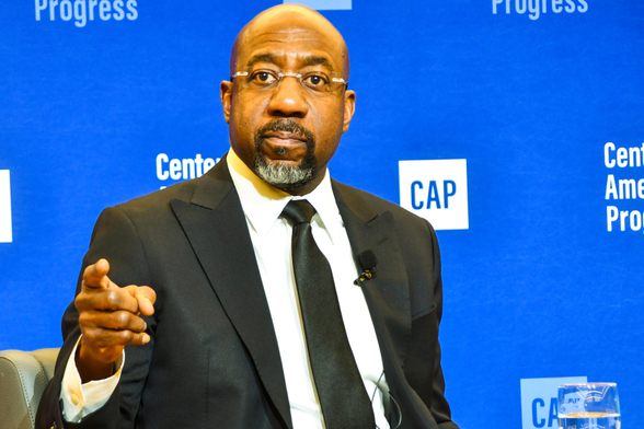 Photo of Sen. Raphael Warnock (D-GA) pointing at the camera.