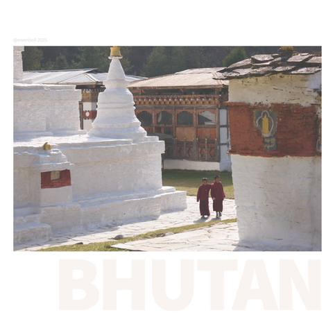 Two young novice monks wander the stupa and chorten while on a break from studies