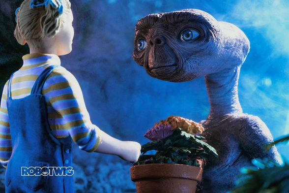 ET  holds a pot of flowers whilst saying goodbye to Gertie as she