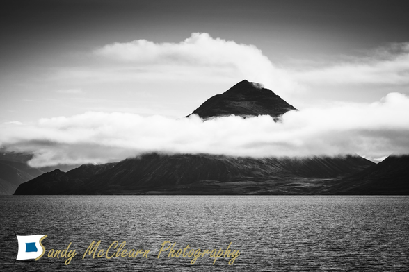 Coastal mountain enshrouded with cloud. 