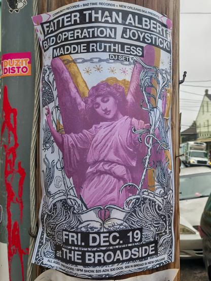 Poster for a music show on a utility pole. 