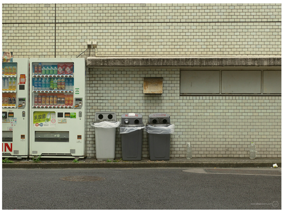A couple of drinks vending machines and three bins for the cans and bottles. Which, for many years, have been something I have been shooting a series of. As they remind me of little robots. The middle one here appears to have something in his right eye. 
