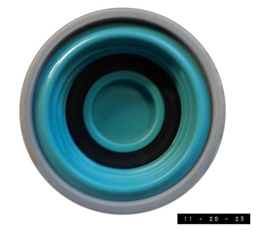 The screw cap to my favorite water bottle.  The threads are made of green plastic. The outer rim is gray plastic.   The sealing washer is black. The whole assembly measures about an inch and three-quarters across.   The translucent green bottle it seals holds 24 oz. of water.  I'm told that screw caps like this have been around for about 175 years.  I've had this one for just a fraction of that time.  Despite its relative youth, I've grown quite fond of it.  There's so much of reality that I have no control over.  Having the ability to fill a bottle with water, screw the top closed, and know that the water isn't going to leak out counts as a major victory over the forces of chaos, entropy, and evil.  I savor that victory every day.        