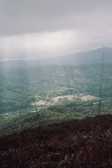 A ray of sunshine over a clearing in the mountains.