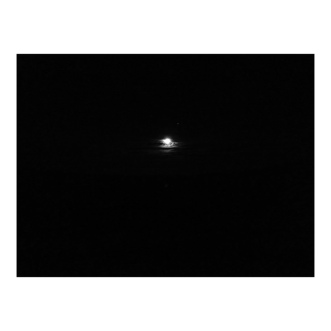 It is all black, except for the full moon behind a small bank of clouds in the centre, and the Venus next to it. (Version françæ) Photo toux noirx à part al centre læ plæn lune derrière æn petix banc de nuages et l’étoile dal bergær à côté.