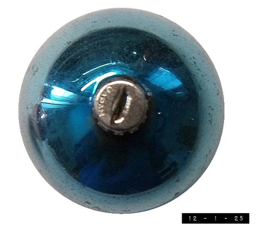 Overhead view of a vintage blue glass Christmas bulb.  About an inch in diameter.  I suppose it's at least 60 years old.  It's inspiring to see how long something so fragile can survive if given the proper attention and care.  The age spots and flaked off bits show how blemishes can actually make something more beautiful rather than less.  Rediscovering it every December is always a thrill.  Maybe I'll be lucky enough to rediscover it next summer if I need a mid-year boost . . . .      