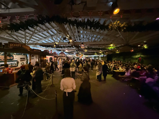 Crowd shot of a busy food court area. Kid had a gigantic crepe, while his parents shared a bangers and mash plate.