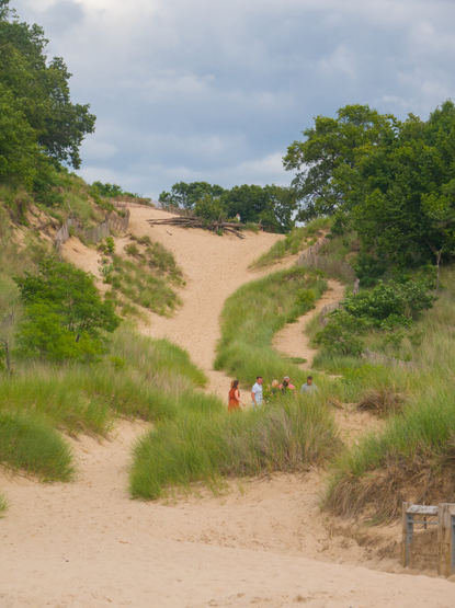 A steep trail goes up one of the dunes.