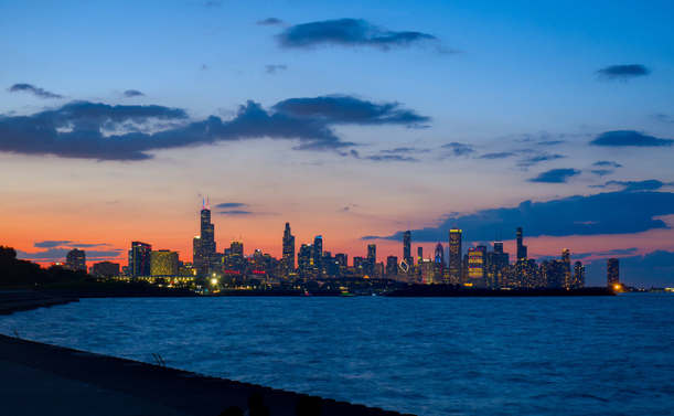 Chicago skyline just lit up in the dusk. Slightly cloudy.