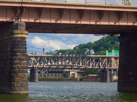 One bridge frames two other bridge that appear layered on each other.