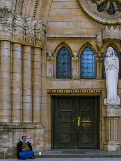 Woman sitting outside the main gate of Cathedral Notre-Dame of Luxembourg
Captured by Komeil Karimi