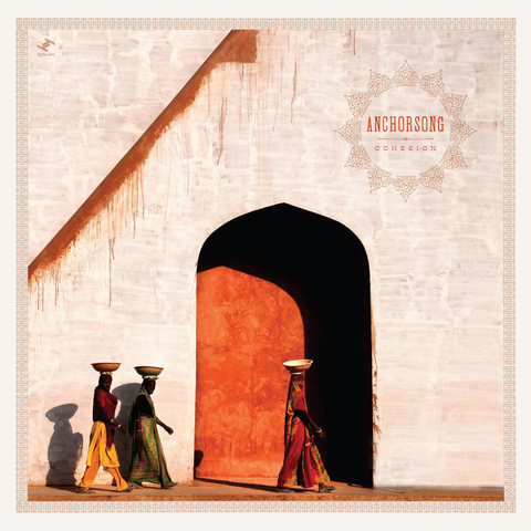 Album cover of Cohesion by Anchorsong.
The artwork shows a large, weather-worn white wall with an arched doorway filled with warm orange light. Three women walk in front of it from left to right, each carrying a bowl on her head. Their clothing is vibrant—reds, greens, and yellows—and the strong sunlight casts long shadows behind them. The scene feels minimalistic, geometric, and inspired by South Asian architecture and everyday life.