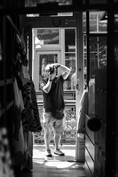 Black and white mirror selfie photograph. 