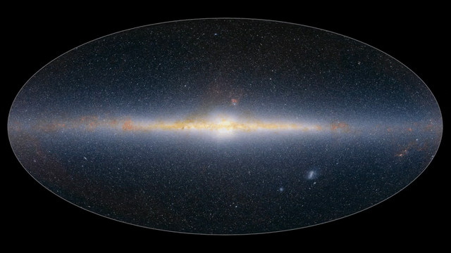 Infrared colors are invisible to the human eye but are represented here in visible colors. The main image is dominated by infrared colors emitted by hot hydrogen gas (blue), and cosmic dust (red), but the image also includes infrared colors selected to highlight the presence of stars (blue, green, and white). The bright feature running through the middle of the images is the Milky Way galaxy, lit up by the billions of stars it contains. Most of the points of light above and below it are other galaxies.