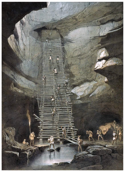 View of a cavern forming a natural well in the area of Bolonchen, a town in the Mexican state of Campeche. People are seen carrying jugs of water up a steep openwork walkway.