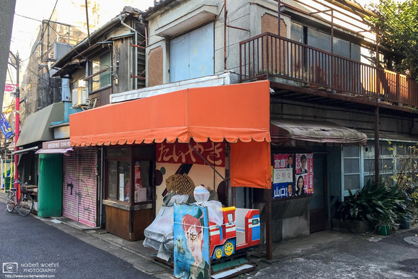 Old buildings and colorful but partially defunct store fronts in the Itabashi Ward of Tokyo, Japan.