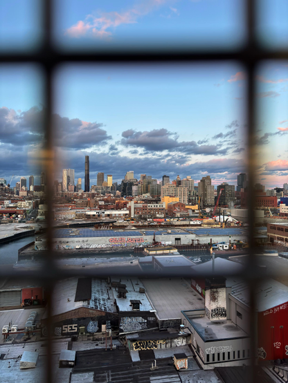 Another view of the same skyline, this time with the camera closer to the window so that the scene is framed only by two vertical and two horizontal wires in the grid screen.