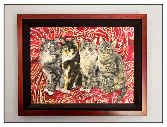 An oil painting of four cats sitting upright close together in the same pose, looking directly at the viewer. From left to right: Loki, a long-haired gray and white cat; Kali, a black, orange and white calico; Sachi, a gray tabby with a white snout, chest, and paws; and Max, a more uniformly gray tabby with darker striped markings. The cats are surrounded by a red backdrop with a pattern of light paisley outlines. The painting is set in a black border within a picture frame of rich red wood, mounted on a white wall.