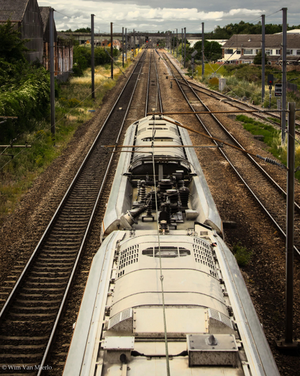 The roof of a modern train as it passes underneath the camera on the mainline.