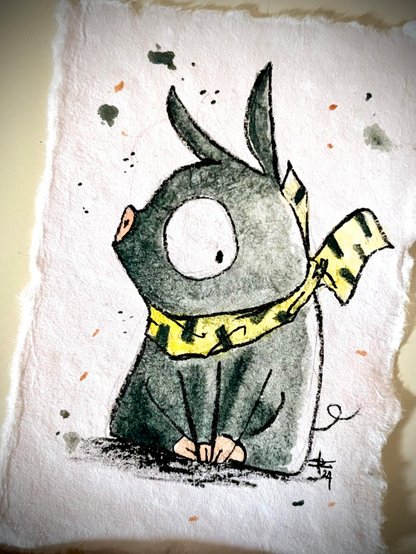 P-Chan from Ranma 1/2. A dark green small pig with very big white round eyes and a yellow and black bandanna around his neck. He is seated on his back legs, frontal body, profile heads turned to the right, but the eye is looking at the front.  White background with watercolour splashes. Watercolour and ink on handmade paper.
