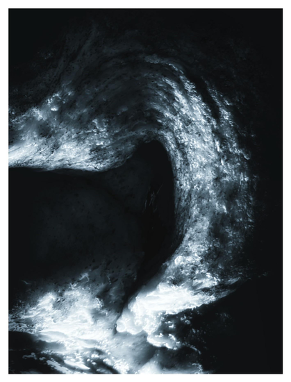 Closeup of the same loaf of bread that highlights one of its swirling contours, desaturated and given a cool-toned glow to resemble a nebula in the darkness of space.