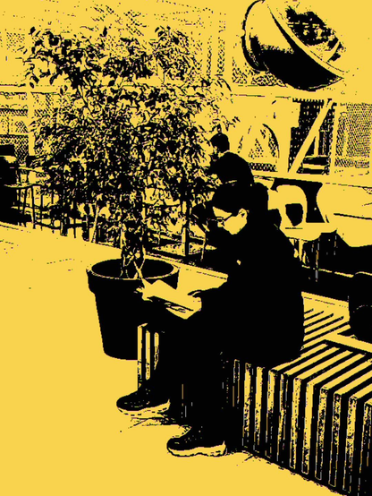A young woman sits on a bench, absorbed in reading a book. Beside her, a large potted plant dissolves into rough pixel patterns. The harsh yellow filter drains the scene of everyday comfort, isolating the figure within an empty, muted urban space. Reading becomes an act of quiet resistance here — a moment of inward focus captured by a crude, uncompromising digital eye.