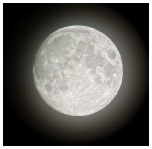 The nearly full moon against a black sky. Its craters are visible but slightly fuzzy behind a thin screen of clouds that gives the moon a soft halo.

Shot on an iPhone 15 attached to a Celestron 130mm reflector telescope.