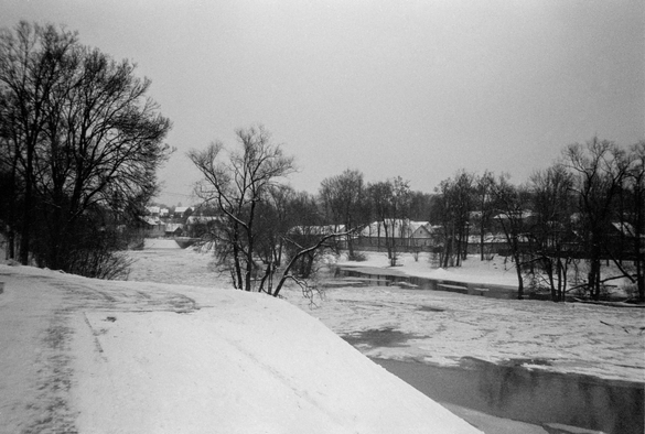 The black-and-white photo shows a winter landscape.