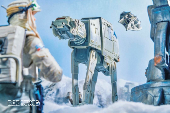 A Snow Trooper watches as At AT's approach. Snowy and sunny backdrop