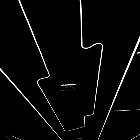 Square photos with very sharp contrast showing a few white lines on a black background. Some lines taper, creating a spatial impression. There are straight lines and one with several curves. The pictures are two variations of one phenomenon: the fluorescent tubes installed on the ceiling of the underpass leading to the tracks at Meidling train station, which was recently redesigned.