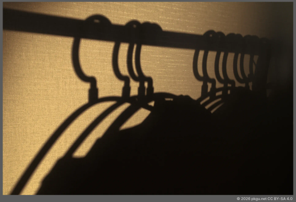 The shadows cast by hanging hangers.