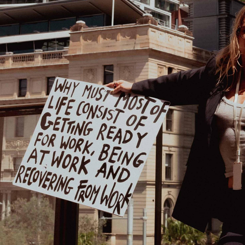 A sign saying: Why must most of life consist of getting ready for work, being at work and recovering from work