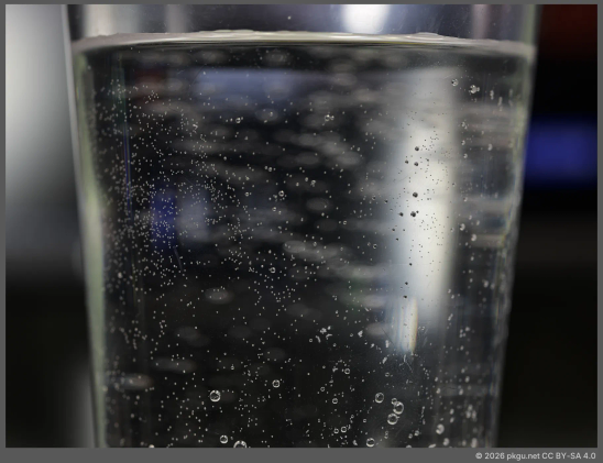 My polycarbonate cup with water. Dark background.