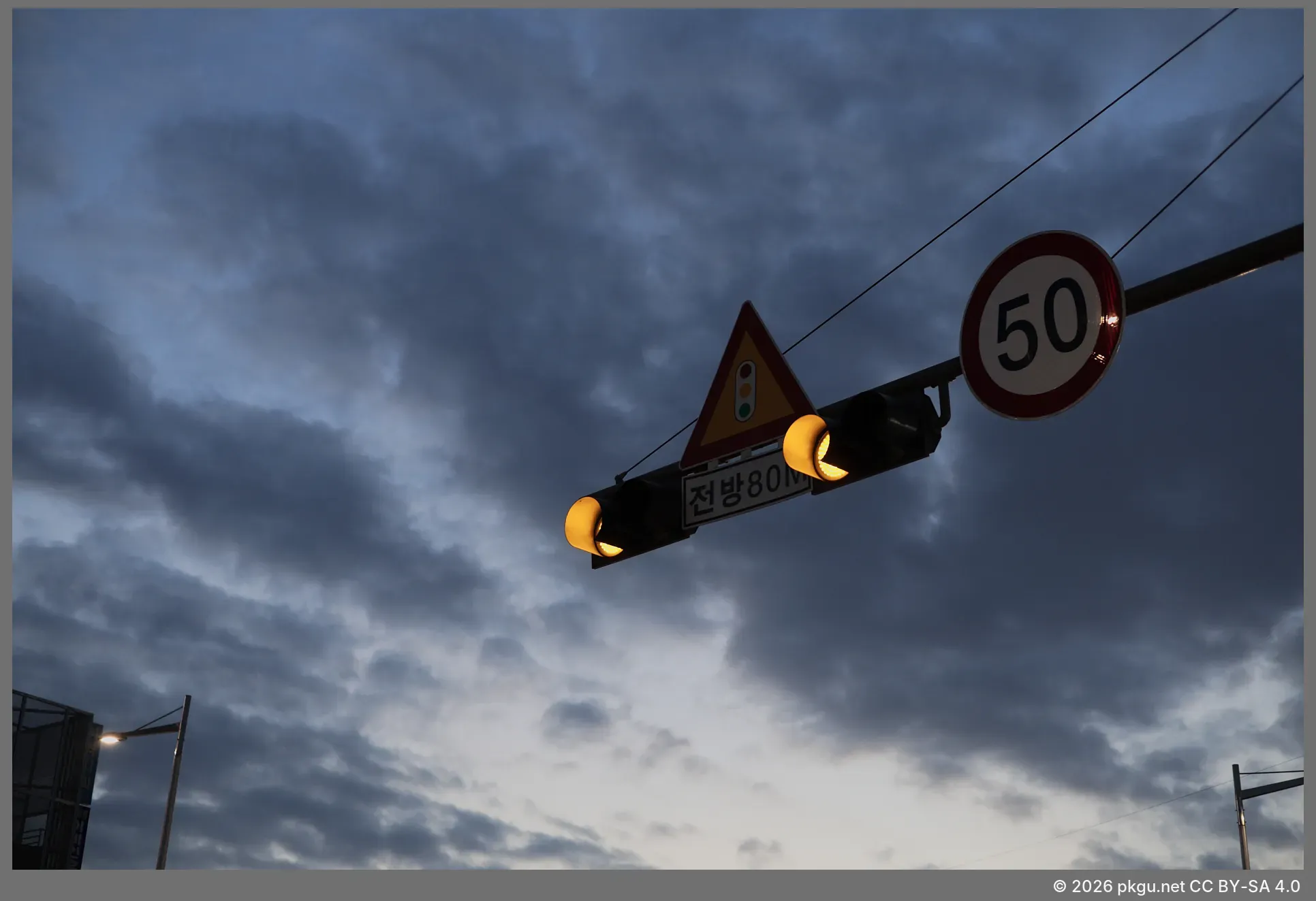 A city sunset, with the traffic light.