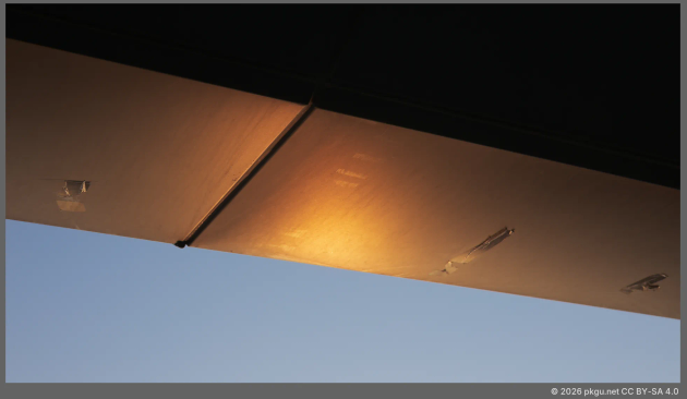 Reflection of sunset light on the steel roof.