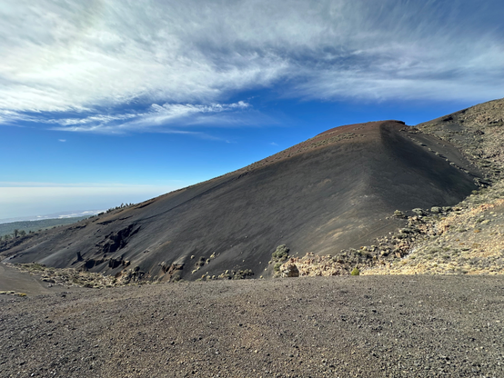 A hill of fine dark volcanic sand gives the landscape a moon-like otherworldly look.
