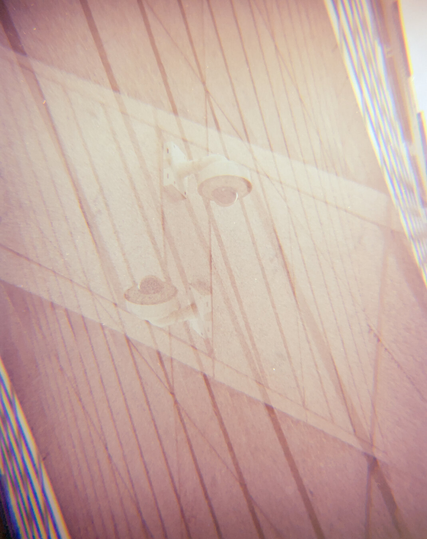 Double exposure photo showing diagonal lines centering on surveillance cameras