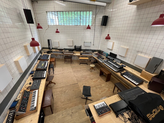 Total of the smem playroom with a selection of mostly vintage and analog synthesizers, eg. Sequential Prophet 5, Roland System 100m and so on