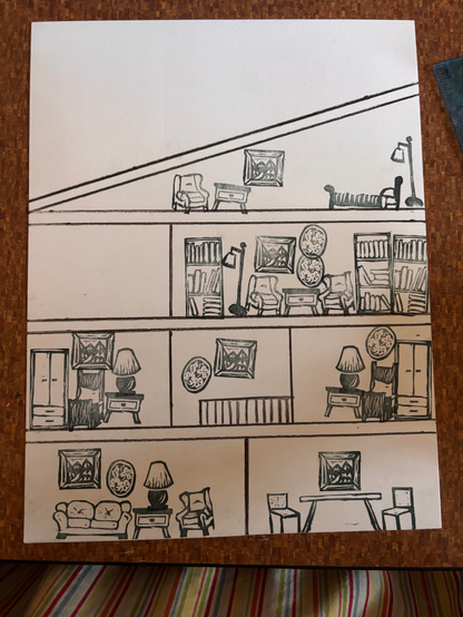 A white page with the simple black line outline of a house with stamped furniture and decorations. 