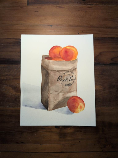 This is a watercolor painting of a paper bag of Georgia Peaches from The Peach Truck.