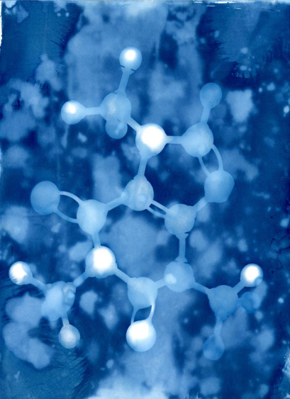 Light colored image of the shadow from a chemical model artistically created on a mottled blue/cyan background.