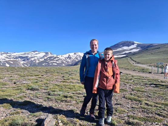 Frankie and his Mum at the start point for his ascent of Mulhacen, seen behind in the snow