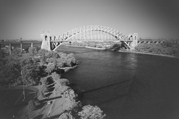A great through arch bridge across East River. The RFK bridge which I was on cast a shadow into the river.