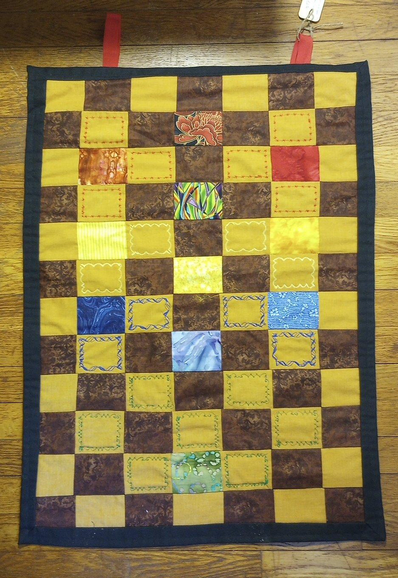 She's a 30" by 22" quilt wall hanging (not counting the tabs, which make it close to three feet tall). The design is the pattern of the Kabbalistic Sephirot using the Four Worlds color scheme of various fabrics in a brown and gold quilt grid background.  The binding is black, and the reverse side is a black fabric with gold metallic wandering detailing. (Photo in thread.)

Asking price is $60 plus shipping for Fediverse buyers, which will go up to $72 plus on the Co-op site. 

DM with your contact info and I'll send you a Venmo, Square, or Paypal link once I have Pirate Ship calculate the insured shipping cost (using your address) and can tell you the total. Until you pay, you're not committed.

TERMS OF SERVICE: These are posted on the Co-op page but I'll reiterate here - there are *no refunds* for porch pirates or other disappeared packages. It is the buyer's responsibility to be sure the package is being delivered to a safe monitored place while people are present. Other refunds will be processed *after* the item is *returned* in good condition.  