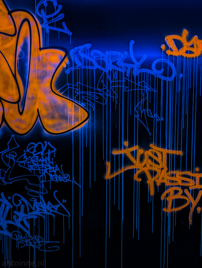 A vibrant, high-contrast piece of graffiti art set against a dark, near-black background. The artwork heavily features a striking color palette of glowing neon orange and deep electric blue, which gives it a distinct blacklight or UV-reactive aesthetic.