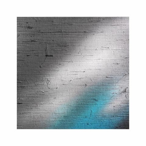 a square image showing a gently blue reflection of a nearby vase on textured wall
