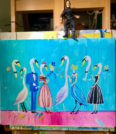 A 3 foot by 2 foot canvas on a paint splattered easel. The canvas has a Marty Feldman doll sitting on top. Some things are mysteries. The canvas has a turquoise background for 75% from top to bottom, with the bottom quarter a vivid pink dance hall floor. Standing in a cluster are seven swans in various forms of transformation to or from human shape. There are two untransdormed humans and two in transition. Two of the seven geese have had no transformation. There is a variety of couture and haberdashery promised, but not yet painted. 