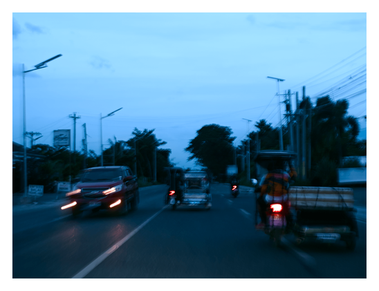 An oncoming red vehicle with streaking headlights passes on the left, while a motorcycle with a sidecar travels ahead on the right. - Google Gemini 3.1 Pro Preview