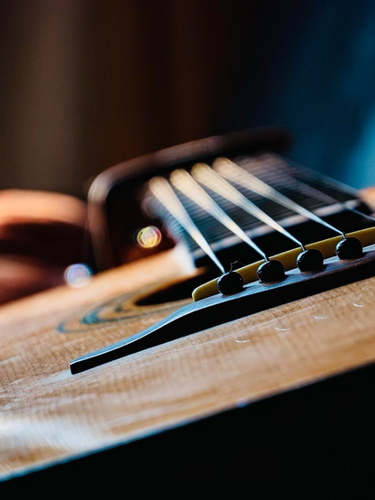 Close up of a guitar in the afternoon sun 